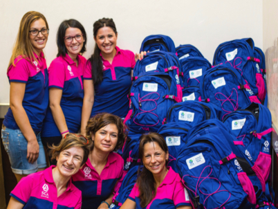 Proud employees working as pavilion hosts during the Team SCA project. (photo)