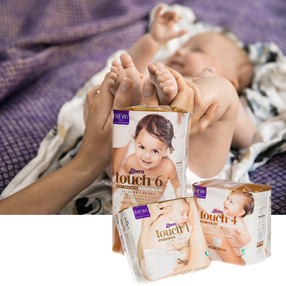 Baby with care products (photo)
